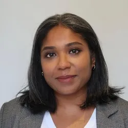 Image of Tasfia smiling over a blank background