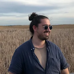 Headshot of Wesley Cornwell standing outside and smiling